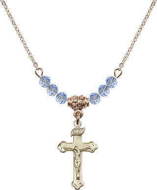 18" Hamilton Gold Plated Necklace with 4mm Light Sapphire Crystal Beads featuring a 14kt Gold Filled Crucifix Medal.