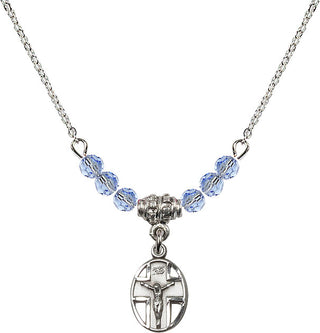 18" Rhodium Plated Necklace with 4mm Light Sapphire Crystal Beads featuring a Sterling Silver Crucifix Medal.