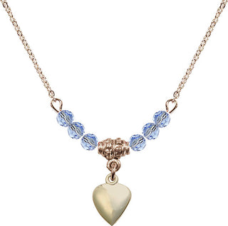 18" Hamilton Gold Plated Necklace with 4mm Light Sapphire Crystal Beads featuring a 14kt Gold Filled Heart Medal.
