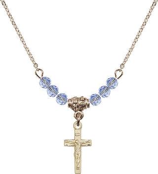 18" Hamilton Gold Plated Necklace with 4mm Light Sapphire Crystal Beads featuring a 14kt Gold Filled Crucifix Medal.