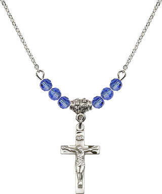 18" Rhodium Plated Necklace with 4mm Sapphire Crystal Beads featuring a Sterling Silver Crucifix Medal.