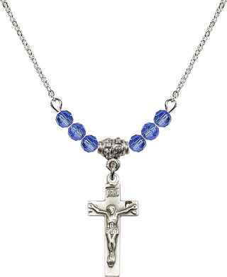 18" Rhodium Plated Necklace with 4mm Sapphire Crystal Beads featuring a Sterling Silver Crucifix Medal.