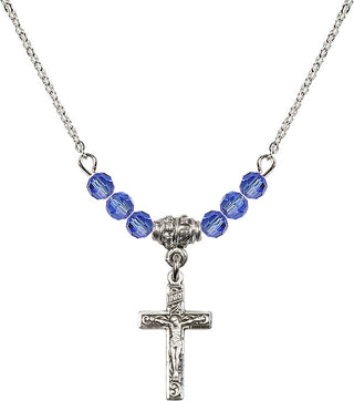 18" Rhodium Plated Necklace with 4mm Sapphire Crystal Beads featuring a Sterling Silver Crucifix Medal.