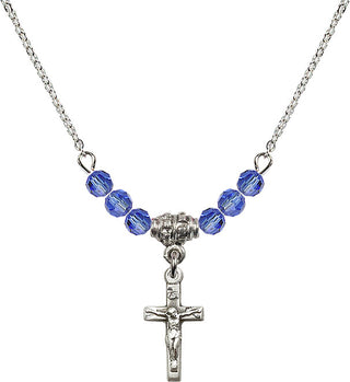 18" Rhodium Plated Necklace with 4mm Sapphire Crystal Beads featuring a Sterling Silver Crucifix Medal.