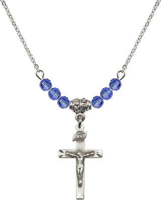 18" Rhodium Plated Necklace with 4mm Sapphire Crystal Beads featuring a Sterling Silver Crucifix Medal.