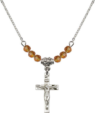 18" Rhodium Plated Necklace with 4mm Topaz Crystal Beads featuring a Sterling Silver Crucifix Medal.