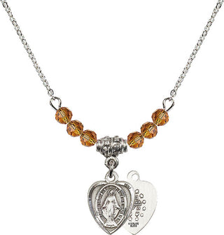 18" Rhodium Plated Necklace with 4mm Topaz Crystal Beads featuring a Sterling Silver Miraculous Medal.
