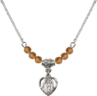 18" Rhodium Plated Necklace with 4mm Topaz Crystal Beads featuring a Sterling Silver Our Lady of Guadalupe Medal.