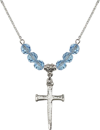 18" Rhodium Plated Necklace with 4mm Aqua Crystal Beads featuring a Sterling Silver Nail Cross Medal.