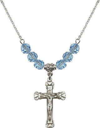18" Rhodium Plated Necklace with 4mm Aqua Crystal Beads featuring a Sterling Silver Crucifix Medal.