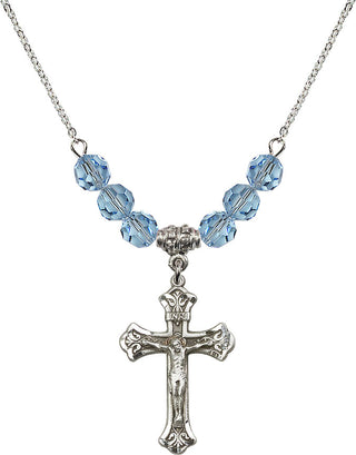 18" Rhodium Plated Necklace with 4mm Aqua Crystal Beads featuring a Sterling Silver Crucifix Medal.