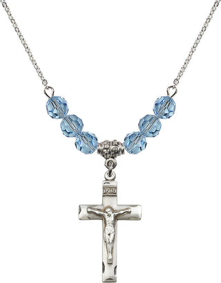 18" Rhodium Plated Necklace with 4mm Aqua Crystal Beads featuring a Sterling Silver Crucifix Medal.