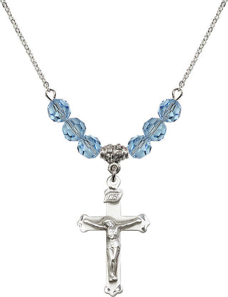 18" Rhodium Plated Necklace with 4mm Aqua Crystal Beads featuring a Sterling Silver Crucifix Medal.