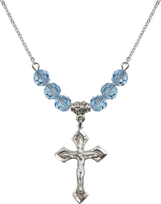 18" Rhodium Plated Necklace with 4mm Aqua Crystal Beads featuring a Sterling Silver Crucifix Medal.
