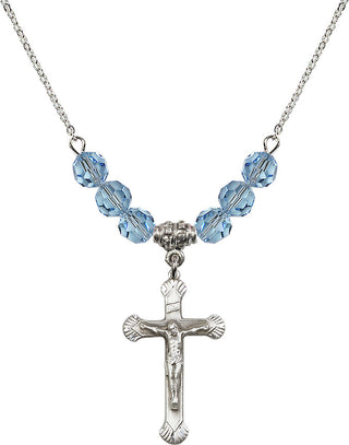 18" Rhodium Plated Necklace with 4mm Aqua Crystal Beads featuring a Sterling Silver Crucifix Medal.