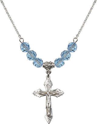 18" Rhodium Plated Necklace with 4mm Aqua Crystal Beads featuring a Sterling Silver Crucifix Medal.