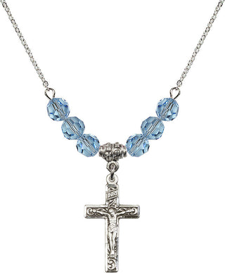 18" Rhodium Plated Necklace with 4mm Aqua Crystal Beads featuring a Sterling Silver Crucifix Medal.