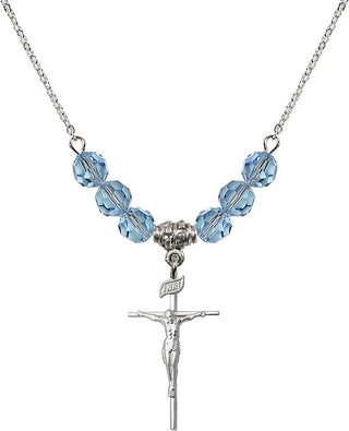 18" Rhodium Plated Necklace with 4mm Aqua Crystal Beads featuring a Sterling Silver Crucifix Medal.