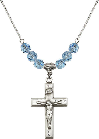 18" Rhodium Plated Necklace with 4mm Aqua Crystal Beads featuring a Sterling Silver Crucifix Medal.