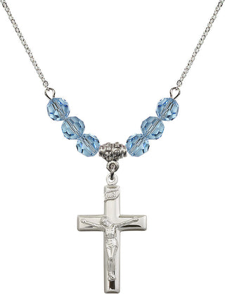 18" Rhodium Plated Necklace with 4mm Aqua Crystal Beads featuring a Sterling Silver Crucifix Medal.