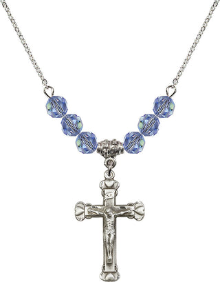 18" Rhodium Plated Necklace with 4mm Light Sapphire Crystal Beads featuring a Sterling Silver Crucifix Medal.