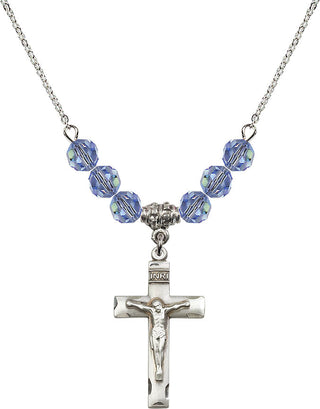 18" Rhodium Plated Necklace with 4mm Light Sapphire Crystal Beads featuring a Sterling Silver Crucifix Medal.