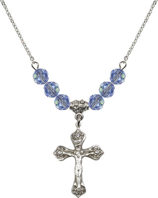 18" Rhodium Plated Necklace with 4mm Light Sapphire Crystal Beads featuring a Sterling Silver Crucifix Medal.