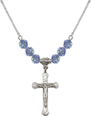 18" Rhodium Plated Necklace with 4mm Light Sapphire Crystal Beads featuring a Sterling Silver Crucifix Medal.