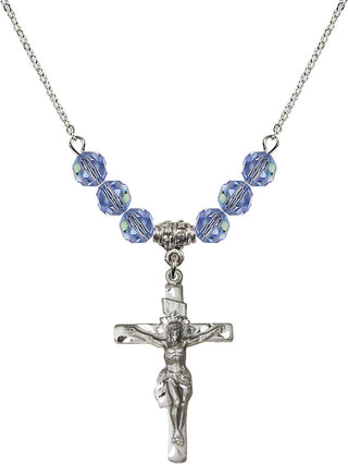18" Rhodium Plated Necklace with 4mm Light Sapphire Crystal Beads featuring a Sterling Silver Crucifix Medal.