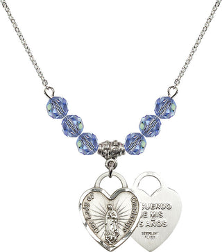 18" Rhodium Plated Necklace with 4mm Light Sapphire Crystal Beads featuring a Sterling Silver Our Lady Guadalupe Heart / Recuerdo Medal.