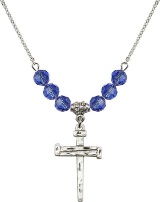 18" Rhodium Plated Necklace with 4mm Sapphire Crystal Beads featuring a Sterling Silver Nail Cross Medal.