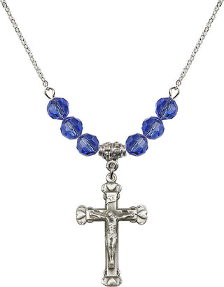 18" Rhodium Plated Necklace with 4mm Sapphire Crystal Beads featuring a Sterling Silver Crucifix Medal.