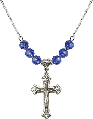 18" Rhodium Plated Necklace with 4mm Sapphire Crystal Beads featuring a Sterling Silver Crucifix Medal.