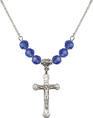 18" Rhodium Plated Necklace with 4mm Sapphire Crystal Beads featuring a Sterling Silver Crucifix Medal.