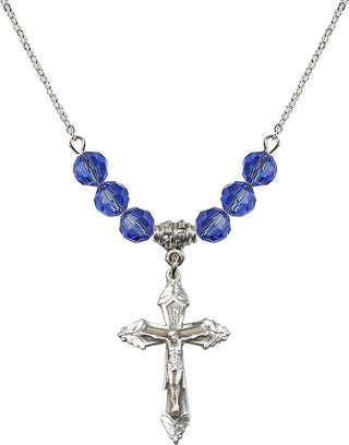 18" Rhodium Plated Necklace with 4mm Sapphire Crystal Beads featuring a Sterling Silver Crucifix Medal.