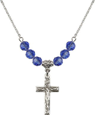 18" Rhodium Plated Necklace with 4mm Sapphire Crystal Beads featuring a Sterling Silver Crucifix Medal.