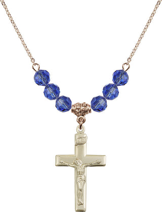 18" Hamilton Gold Plated Necklace with 4mm Sapphire Crystal Beads featuring a 14kt Gold Filled Crucifix Medal.