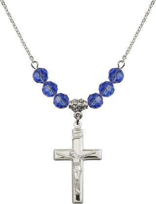 18" Rhodium Plated Necklace with 4mm Sapphire Crystal Beads featuring a Sterling Silver Crucifix Medal.