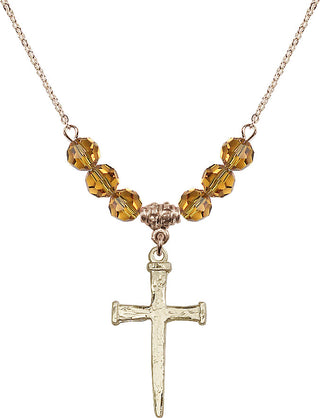 18" Hamilton Gold Plated Necklace with 4mm Topaz Crystal Beads featuring a 14kt Gold Filled Nail Cross Medal.