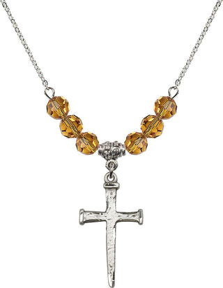 18" Rhodium Plated Necklace with 4mm Topaz Crystal Beads featuring a Sterling Silver Nail Cross Medal.