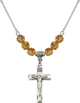18" Rhodium Plated Necklace with 4mm Topaz Crystal Beads featuring a Sterling Silver Crucifix Medal.