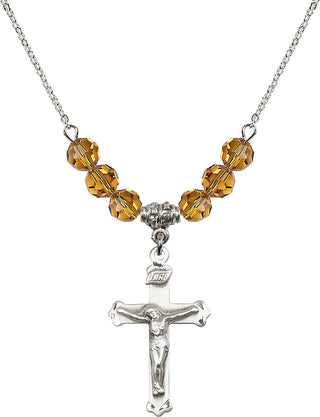 18" Rhodium Plated Necklace with 4mm Topaz Crystal Beads featuring a Sterling Silver Crucifix Medal.