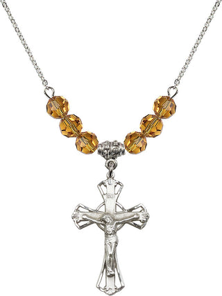 18" Rhodium Plated Necklace with 4mm Topaz Crystal Beads featuring a Sterling Silver Crucifix Medal.