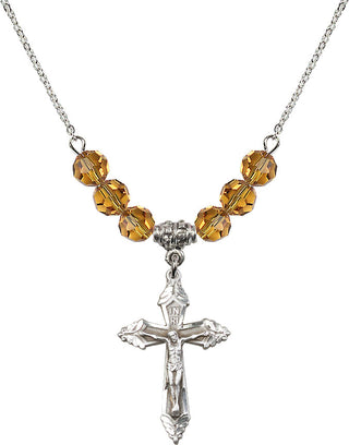 18" Rhodium Plated Necklace with 4mm Topaz Crystal Beads featuring a Sterling Silver Crucifix Medal.