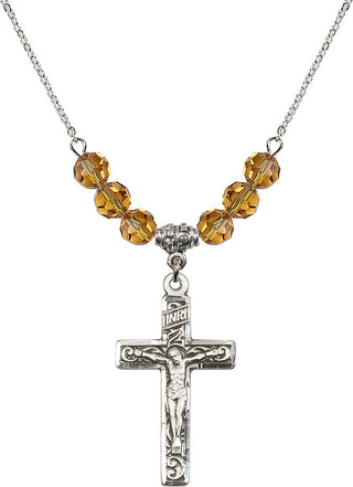 18" Rhodium Plated Necklace with 4mm Topaz Crystal Beads featuring a Sterling Silver Crucifix Medal.