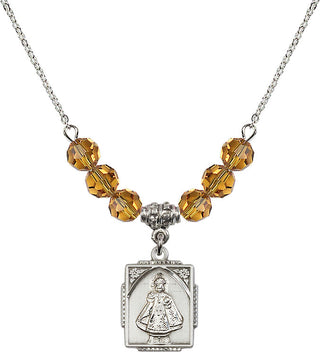 18" Rhodium Plated Necklace with 4mm Topaz Crystal Beads featuring a Sterling Silver Infant of Prague Medal. Engraved Catholic Saint Jewelry