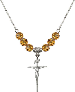 18" Rhodium Plated Necklace with 4mm Topaz Crystal Beads featuring a Sterling Silver Crucifix Medal.