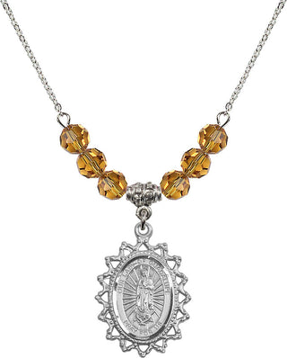 18" Rhodium Plated Necklace with 4mm Topaz Crystal Beads featuring a Sterling Silver Our Lady of Guadalupe Medal.