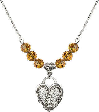 18" Rhodium Plated Necklace with 4mm Topaz Crystal Beads featuring a Sterling Silver Miraculous Heart Medal. Engraved Catholic Saint Jewelry