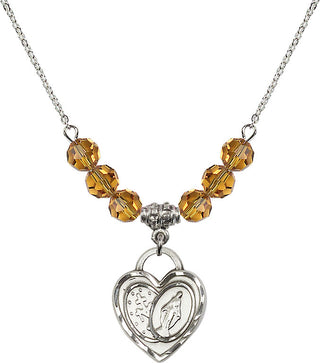 18" Rhodium Plated Necklace with 4mm Topaz Crystal Beads featuring a Sterling Silver Miraculous Heart Medal.